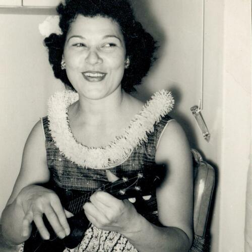 Ella Mahagan plays the ukulele at her home on F Street.